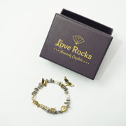 Botswana Agate Bracelet: Wings and Conch Charm